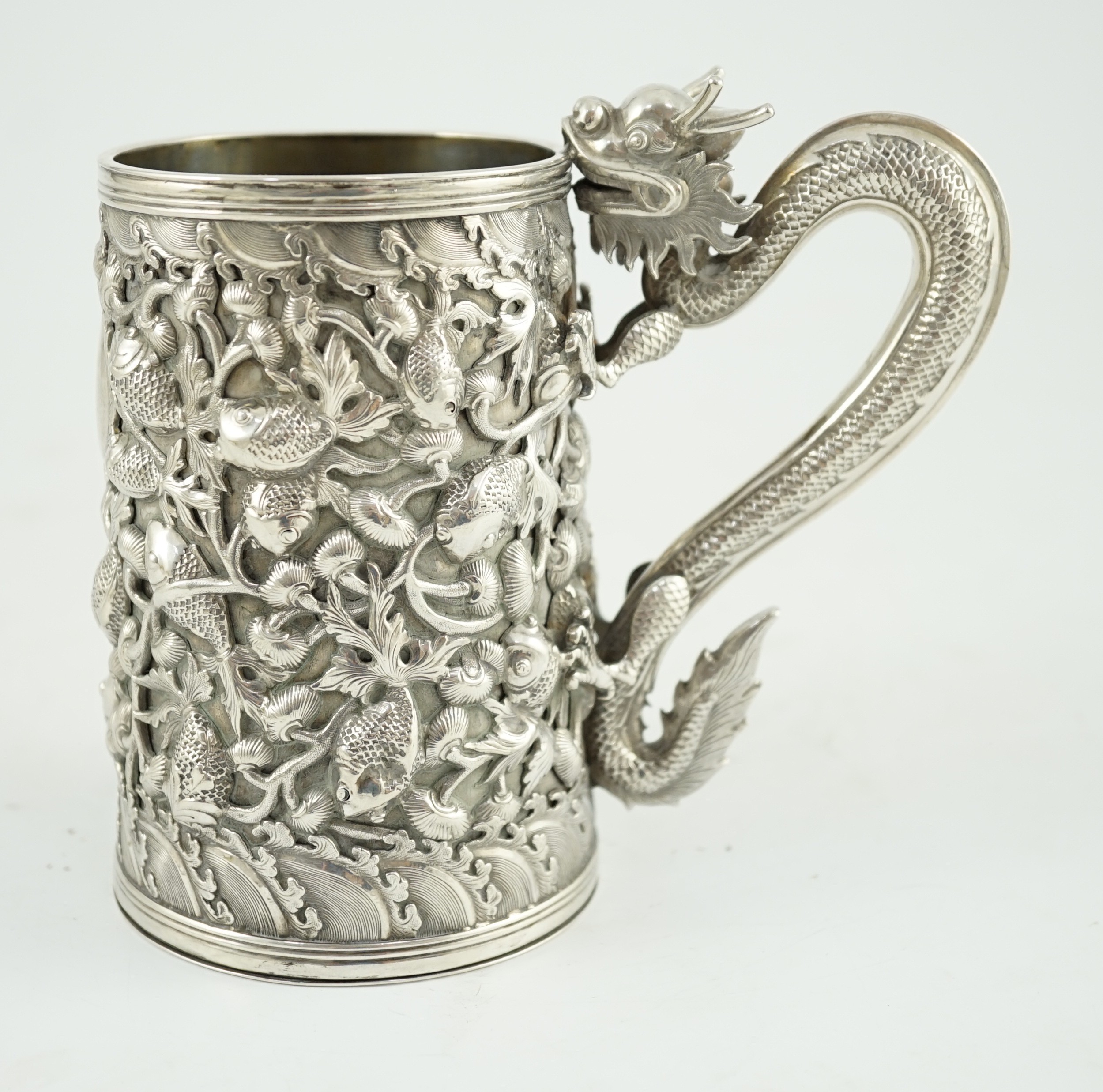A late 19th century Chinese Export double skinned silver mug, by Cumwo
